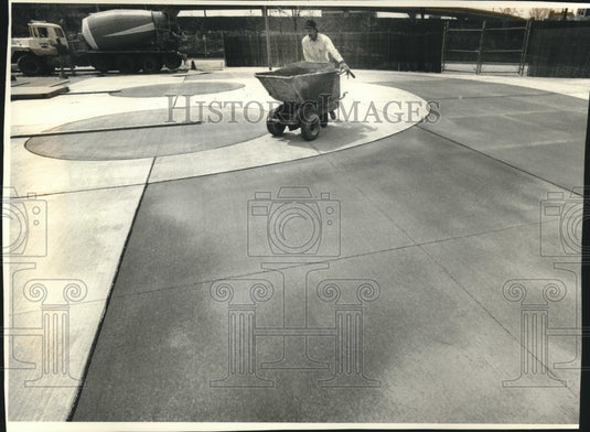 1994, Jeff Krause works on new Summerfest logo set in concrete - Historic Images