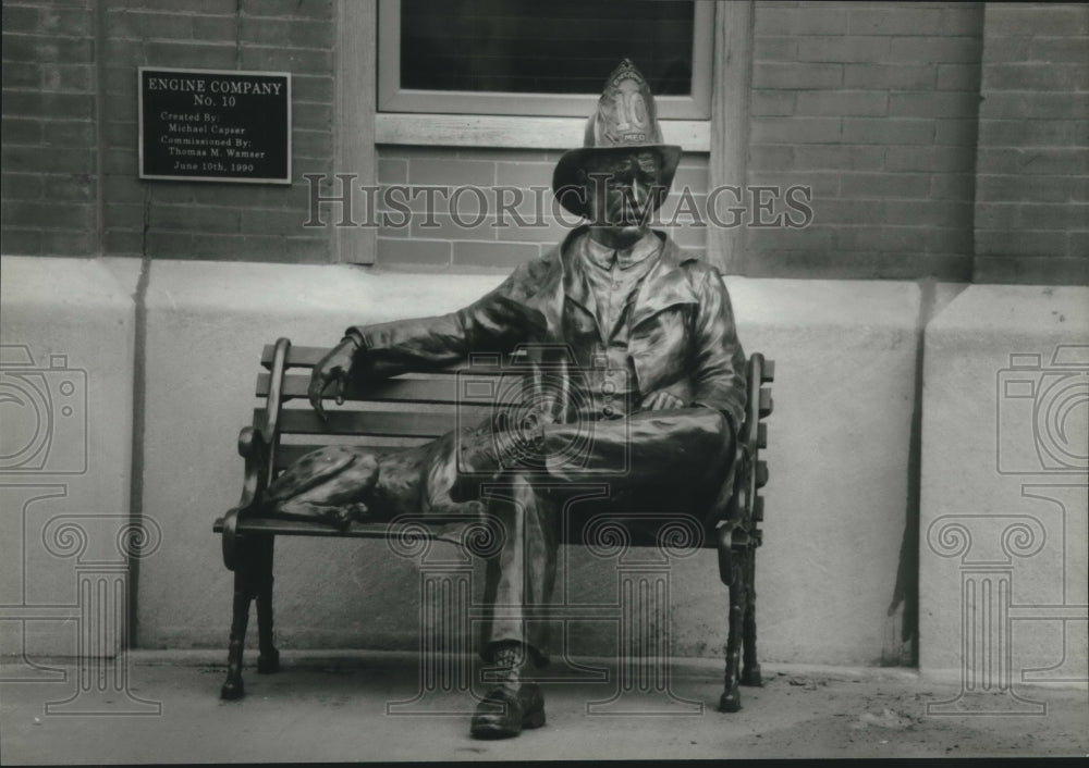 1995, Statue of Fireman Sitting on Bench at Milwaukee Firehouse - Historic Images