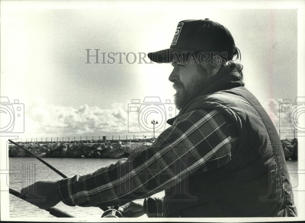 1989, Jeff Thurber sets a fishing line on boat, Port Washington - Historic Images