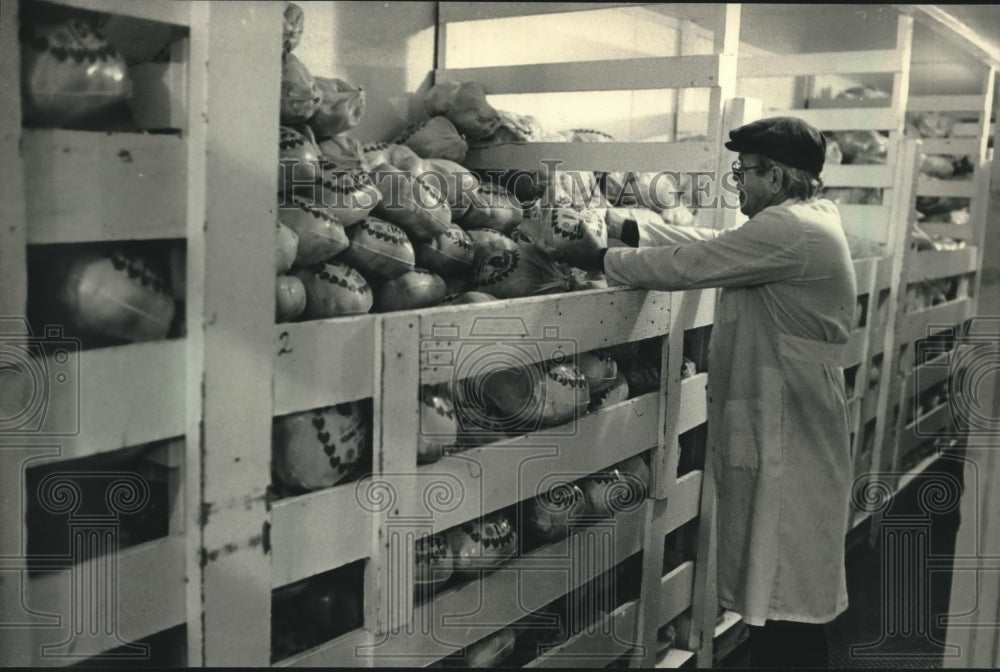 1987, Ken Hayes looks over his freezer supply of turkey - mjc11503 - Historic Images