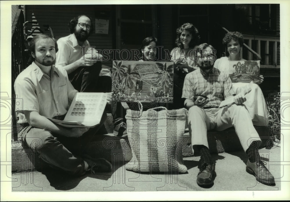 1990, Members of Madison's Trade for Peace Inc showing imported items - Historic Images