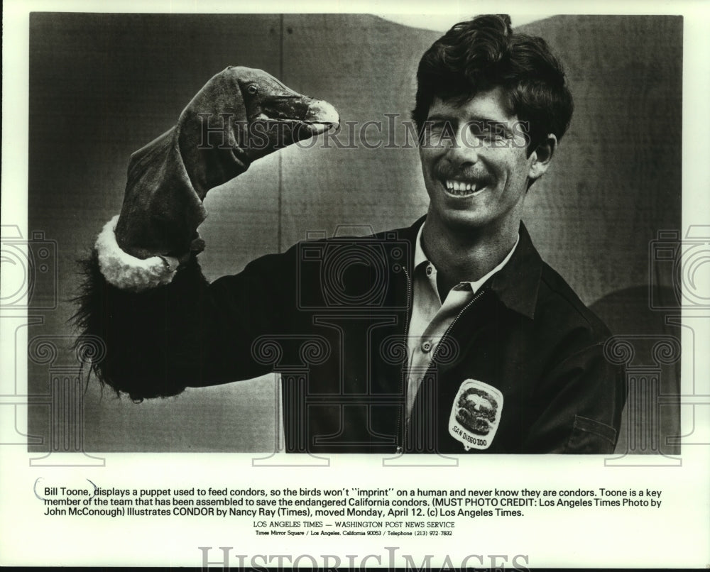1982 Bill Toone Displays Puppet Used to Feed California Condors - Historic Images