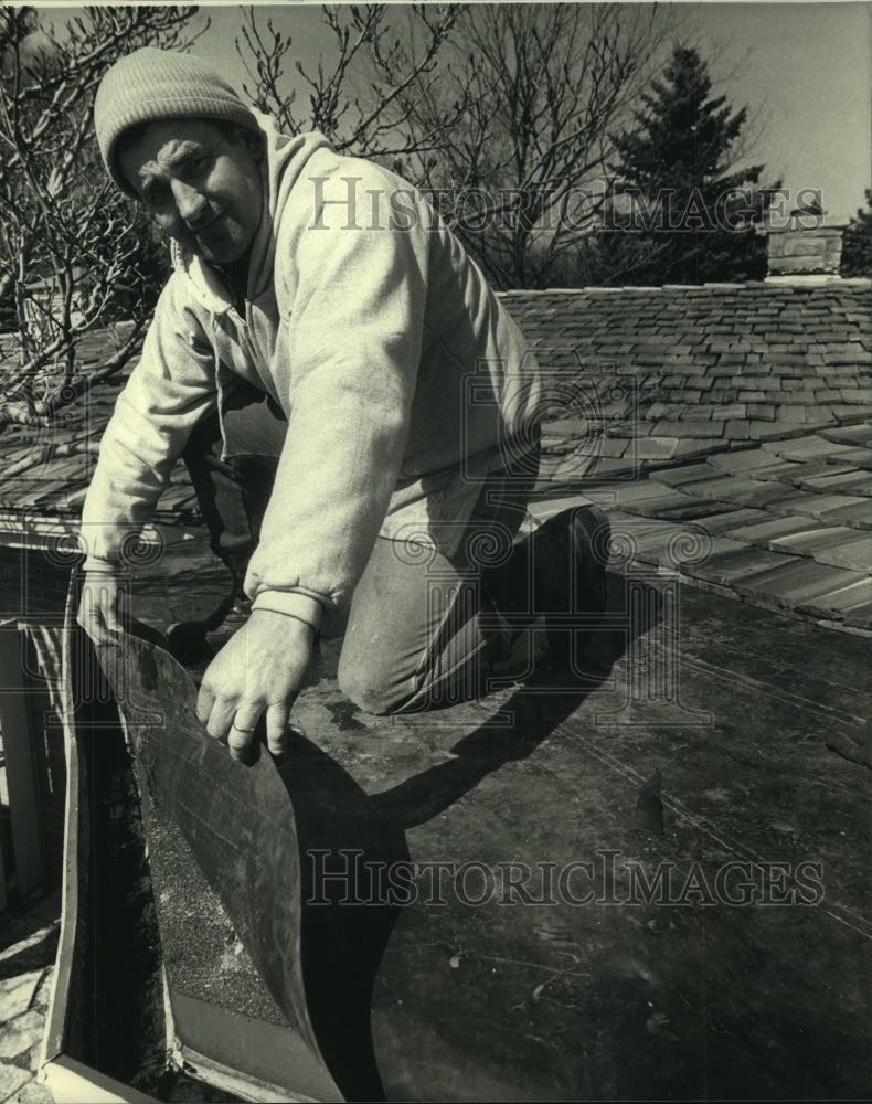 1987 Lloyd Ter Maat, of Ter Maat Builders installs rubber roofing - Historic Images