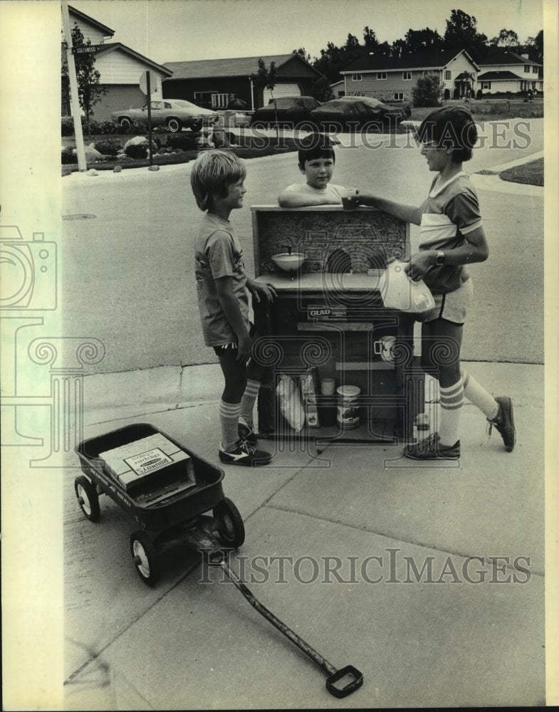 1983, Steve Krall, Ed Kircher, Robby Venz talk about summer business - Historic Images