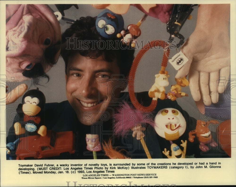 1993 Press Photo Toymaker David Fuhrer surrounded by toys he developed - Historic Images