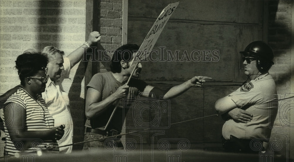 1986, A Striker at Master Lock Company Talking to Police Officer - Historic Images