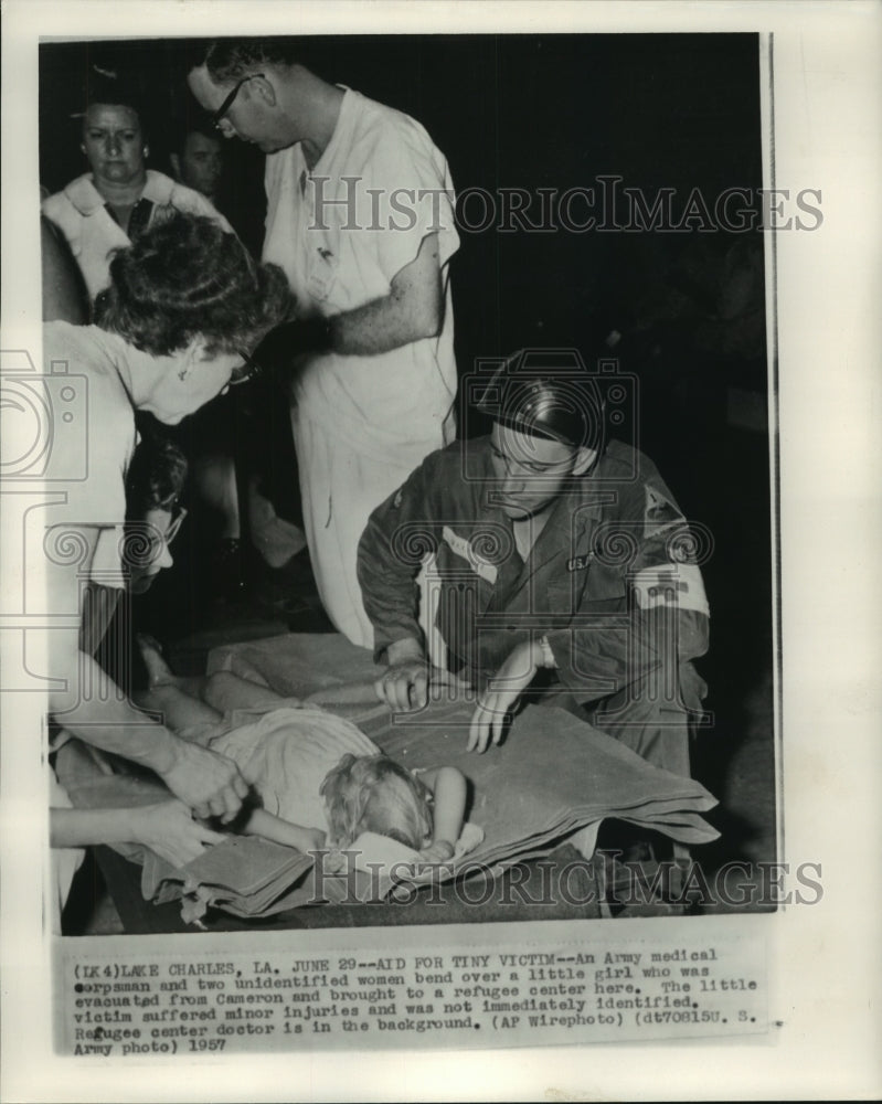 1957, Medical staff in Lake Charles, LA care for little girl - Historic Images