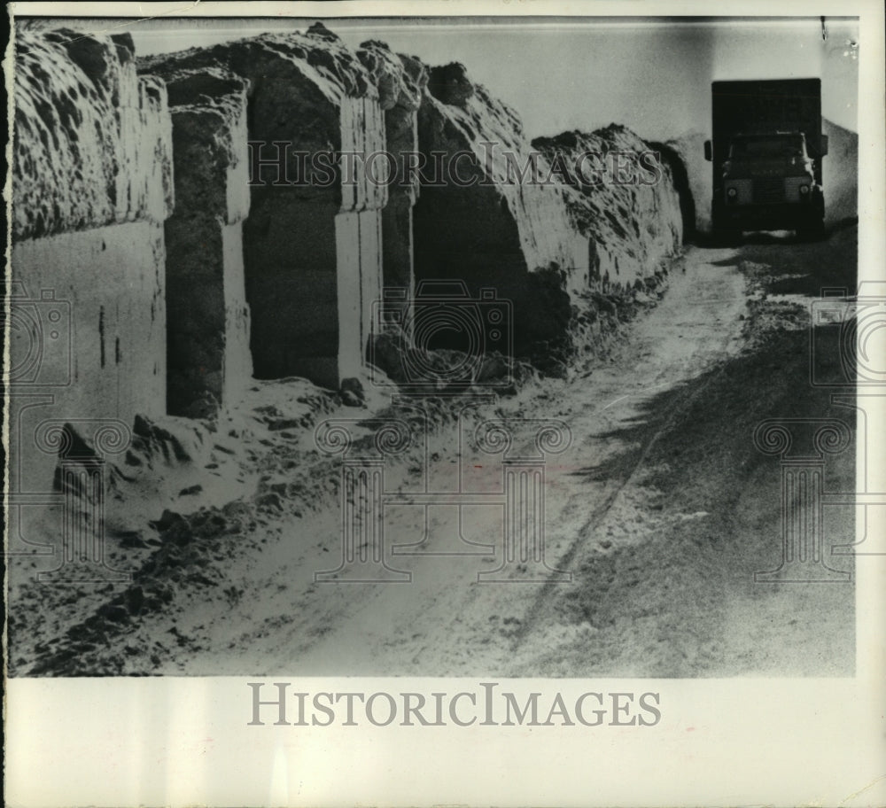 1966, Truck drives through wall of plow-sculpted snow near Absaraka - Historic Images
