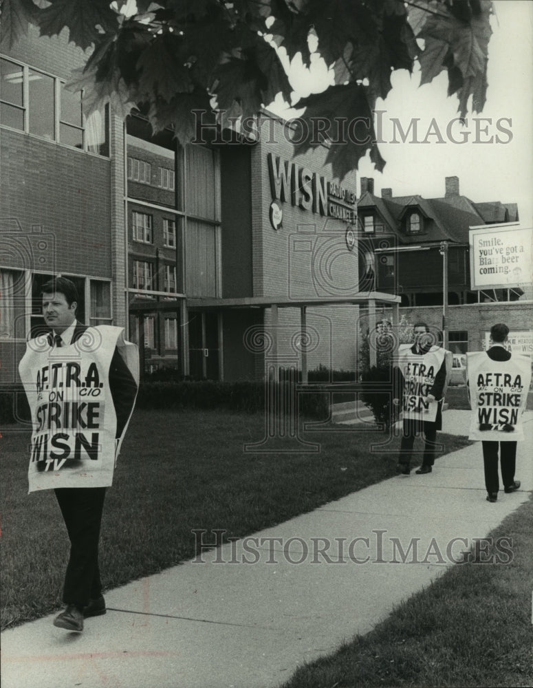 1969, On strike WISN-TV anchorman, John Hogan, walks picket line - Historic Images