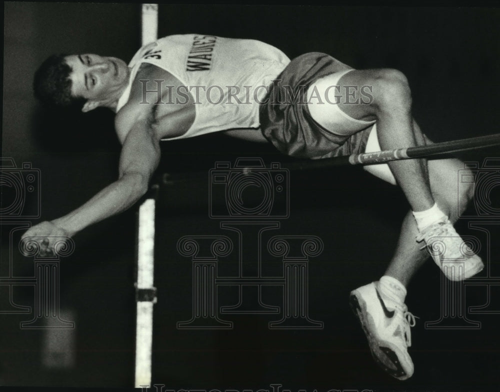 1994 Andy Klokow of Waukesha North clears high jump bar at UW meet - Historic Images