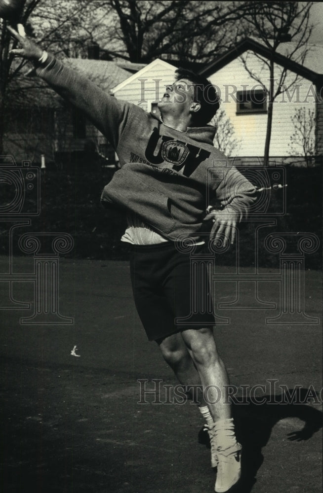 1992 High school student throws shot put in Waukesha - Historic Images