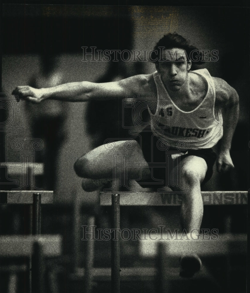 1991 Nathan Smith clears high hurdles for Waukesha North - Historic Images