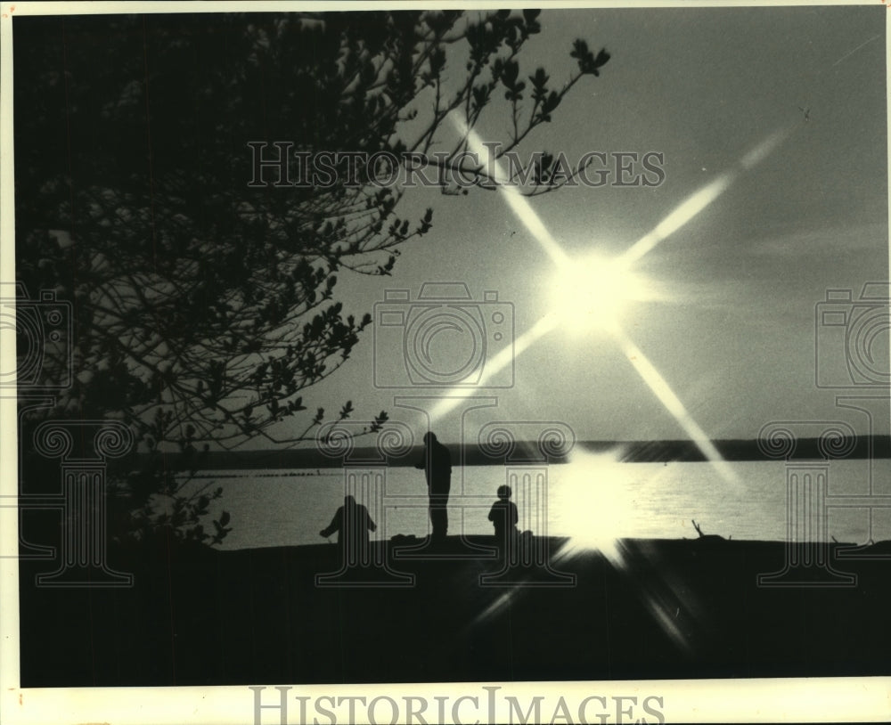 1981, Fishermen at sunset near Ashland, Lake Superior - mjc13078 - Historic Images