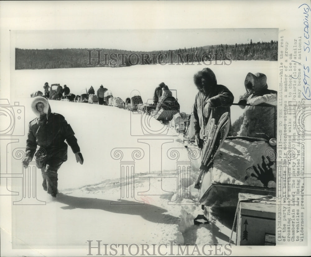 1963 Press Photo Member of group crossing Maine's northern wilderness checks ice - Historic Images