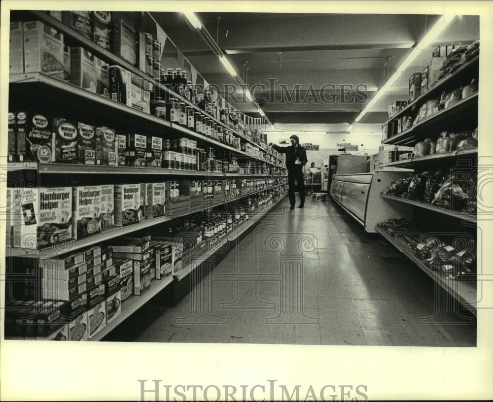 1981, Neat shelves and wide isles accommodate shoppers at the co-op - Historic Images