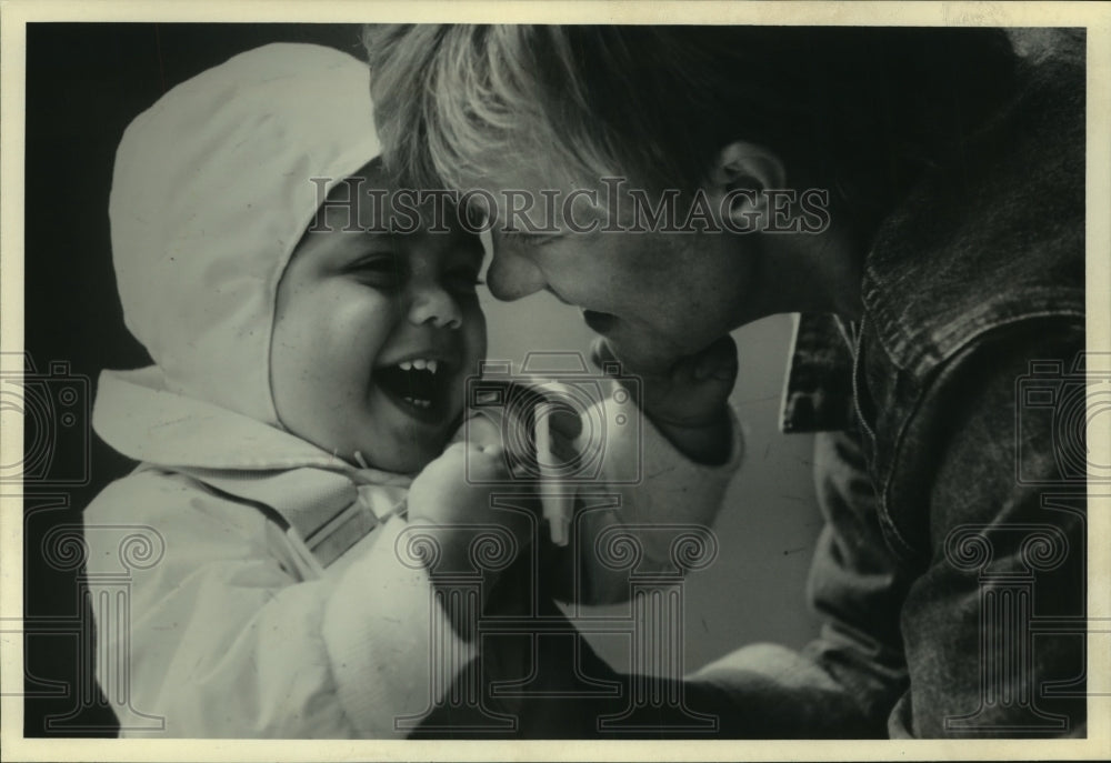 1985 Press Photo Day care worker plays with baby - mjc13252 - Historic Images