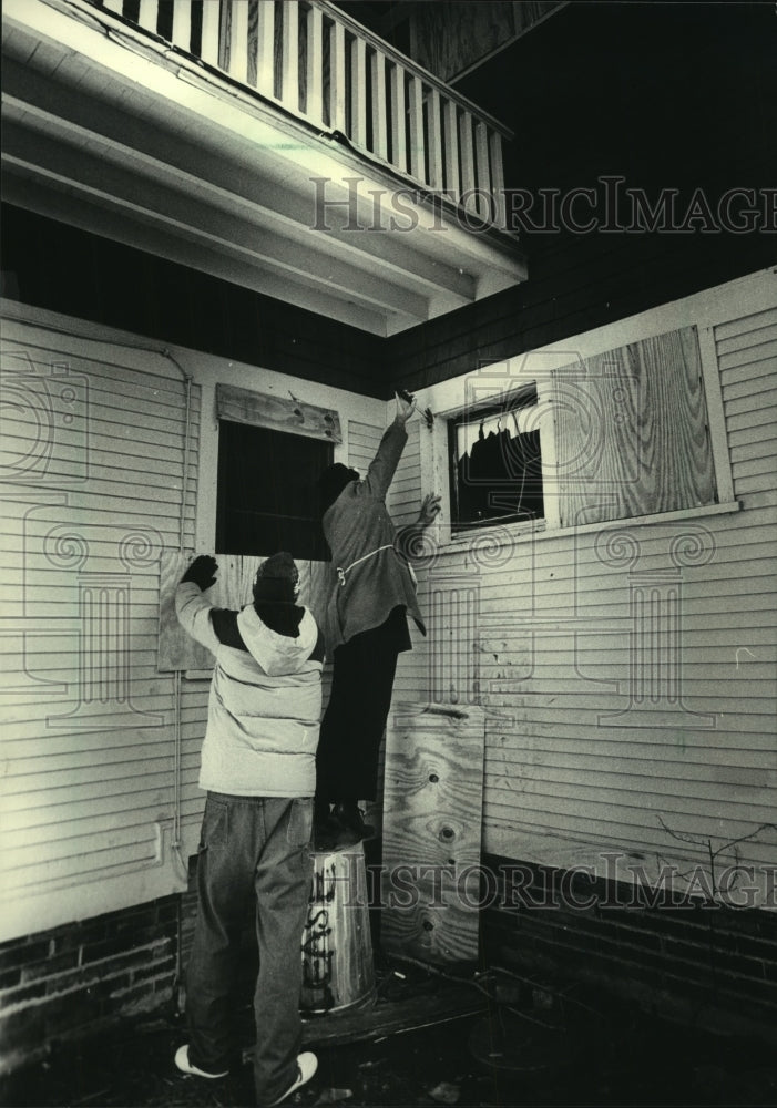 1985, Gerald Bigalke, Bill Geisheker, board up windows, Milwaukee - Historic Images