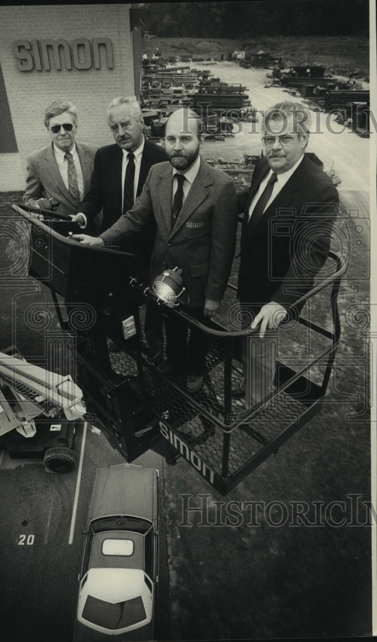 1988 Tom Cooper & others show off Simon Aerials platform, Wisconsin - Historic Images