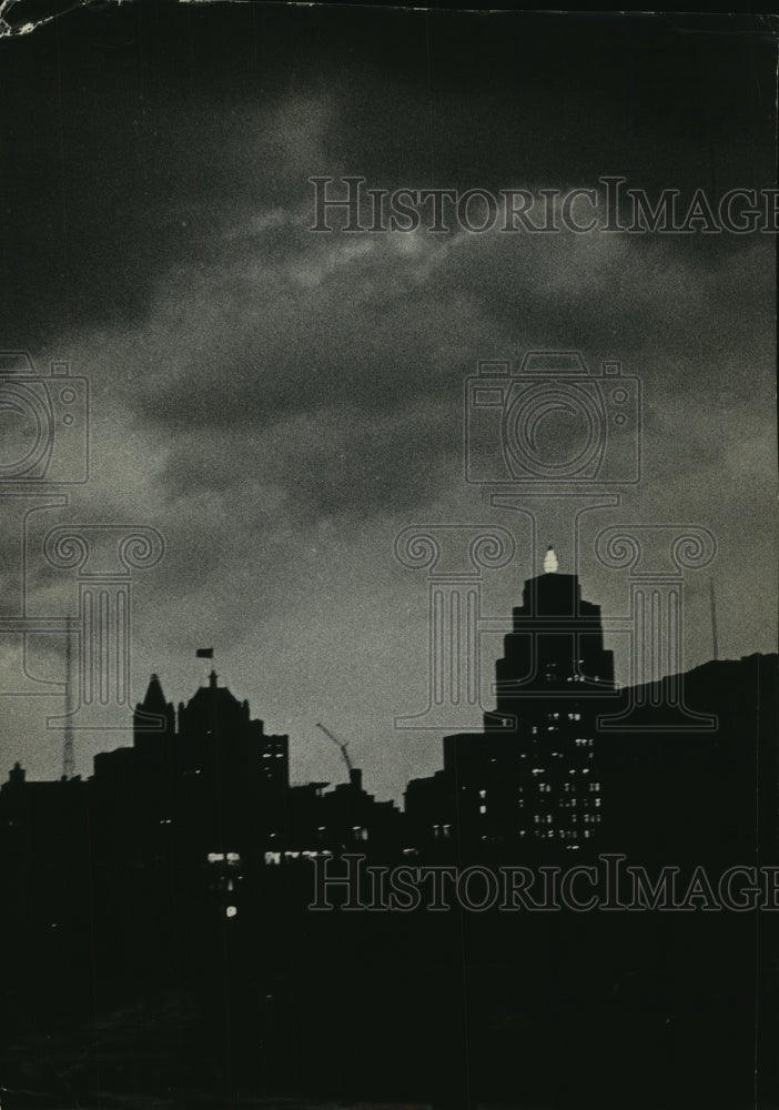 1984, Milwaukee Gas light Co. lights up after squall line darkens sky - Historic Images