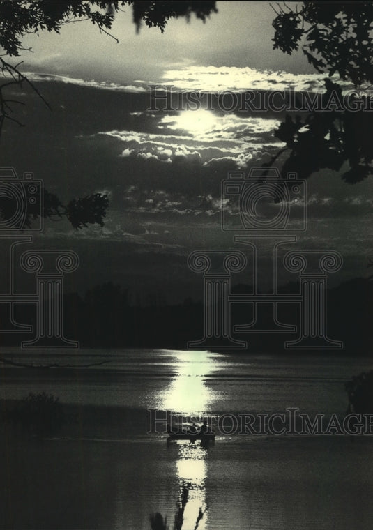1986, Fishermen moved their boat across Lake Emily in Portage County - Historic Images
