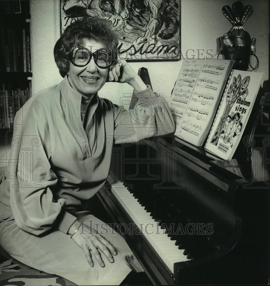 1980 Tybie Taglin sits at the piano - Historic Images