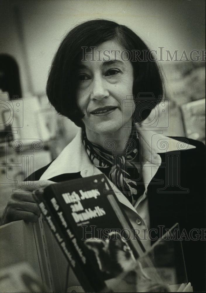 1980 Joan Simons, Wauwatosa, with her book::High Jumps and Dumbbells - Historic Images