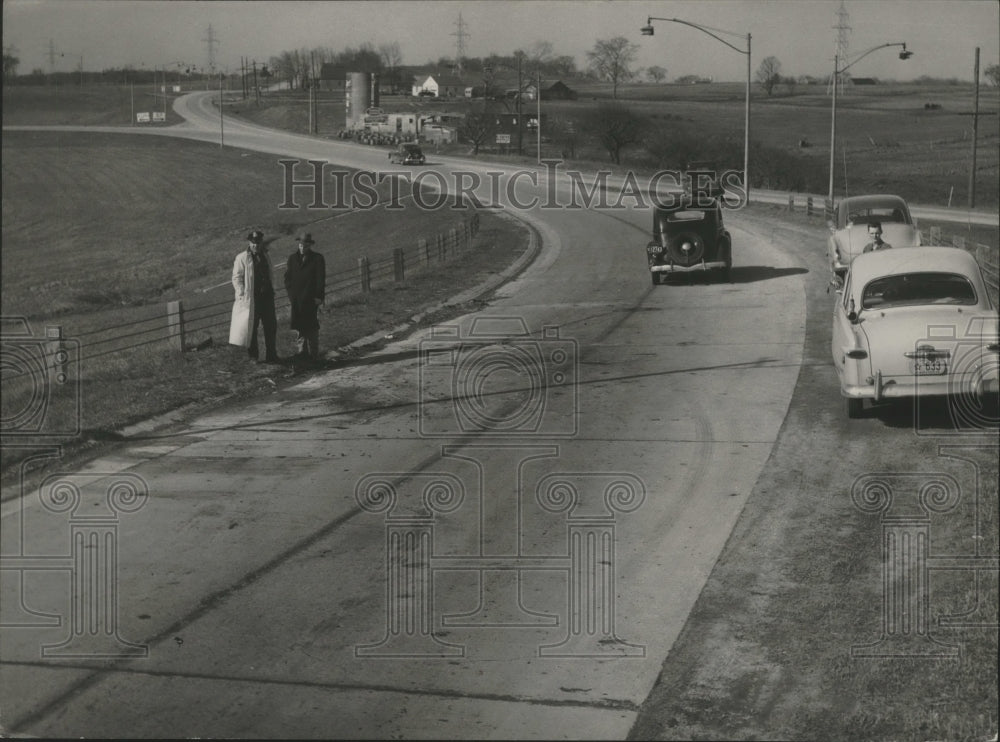 1949 Two men at Intersection of highways 141 and 57, Wisconsin - Historic Images