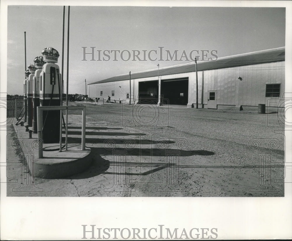 1962, Machinery storage with gas pumps at UW Agricultural School - Historic Images