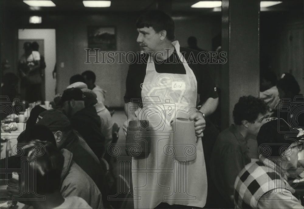 1994, Dave Gerzmehle of Steven&#39;s Point works at a church meal program - Historic Images