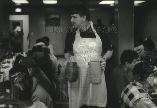 1994, Dave Gerzmehle of Steven's Point works at a church meal program - Historic Images