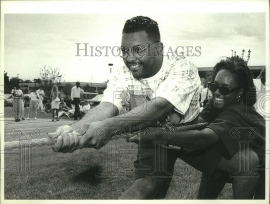 1993, Terrance Brown, Colette Hands, fund raising tug-of-war game. - Historic Images