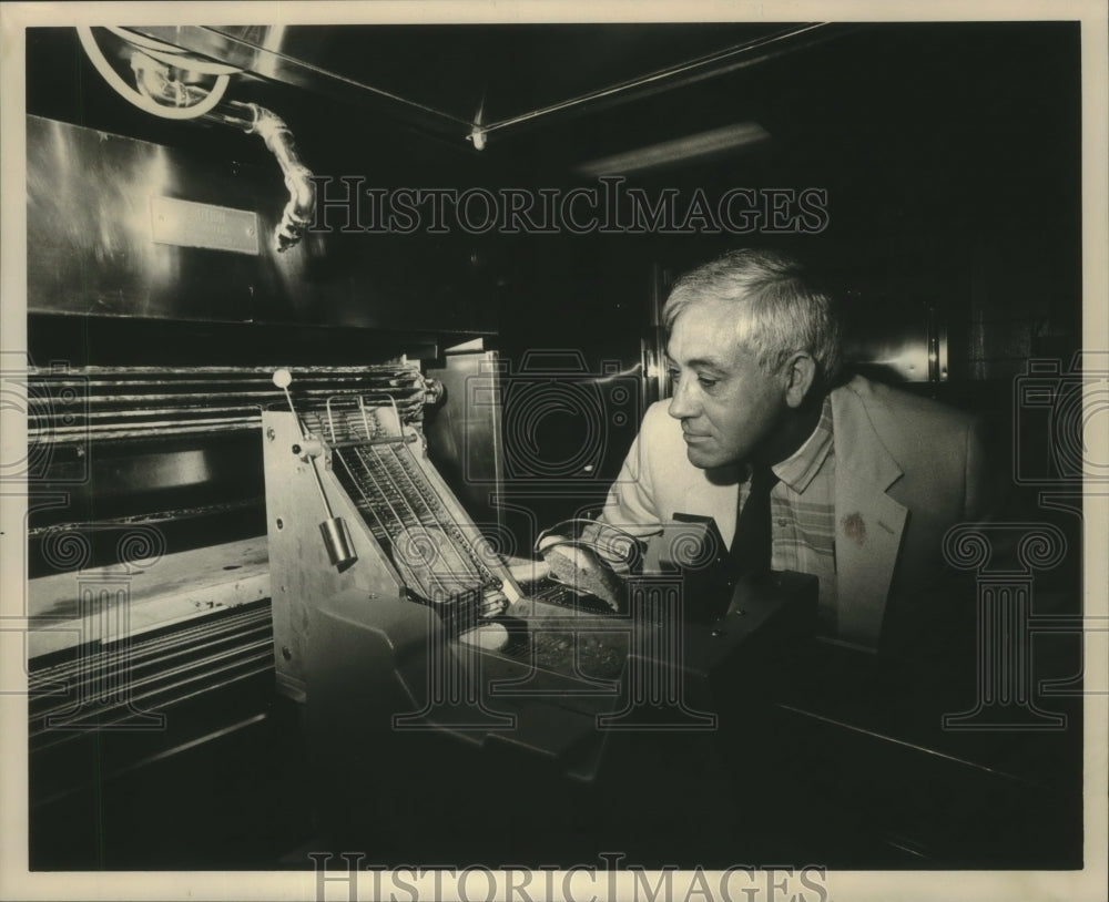1987, Thomas Phillips uses the burgermaker, University of Wisconsin - Historic Images