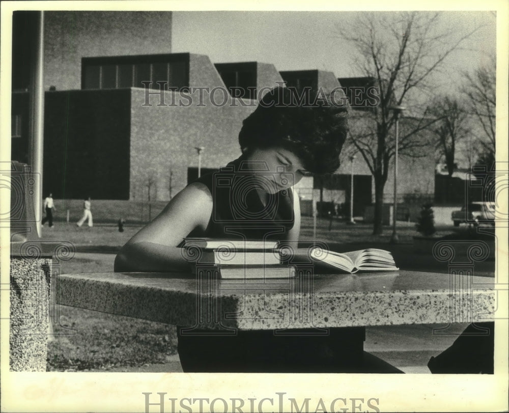 1980, University of Wisconsin-Superior's Arts building behind student - Historic Images
