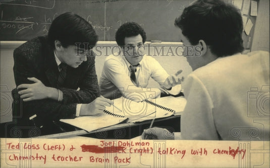1986, Brian Pack Chemistry teacher, with students talking, Milwaukee. - Historic Images