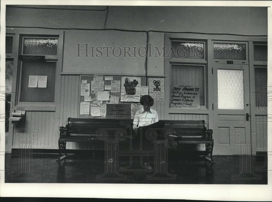 1977 Person sits in Old Main at University Wisconsin-Stevens Point - Historic Images