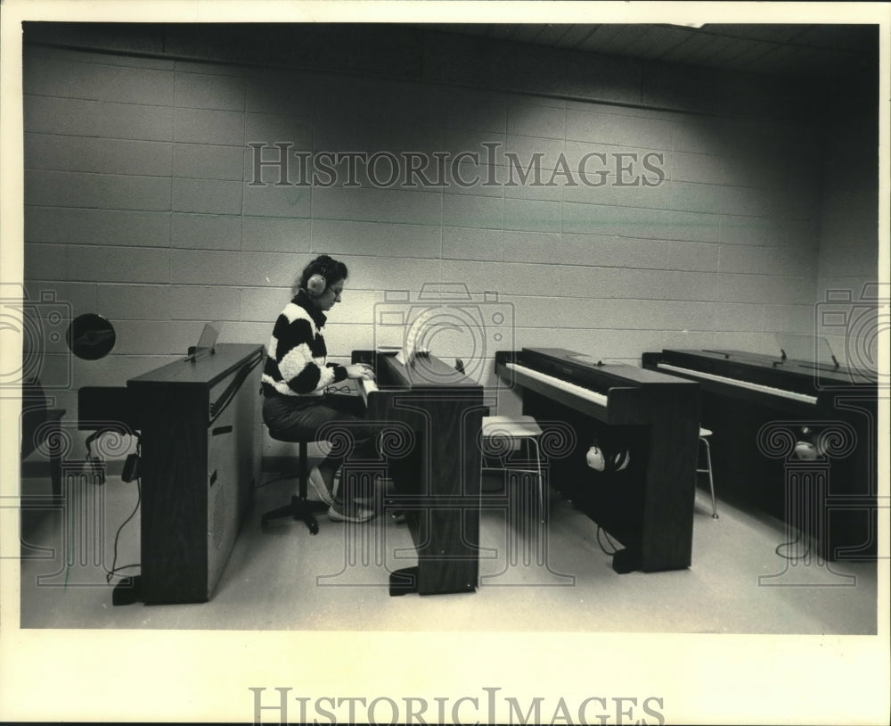 1987 Linda Buth practiced on the piano at UW - Washington County - Historic Images