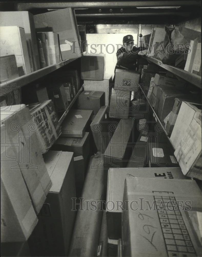 1983 Vitalis Slosarczyk prepares deliveries United Parcel Service. - Historic Images