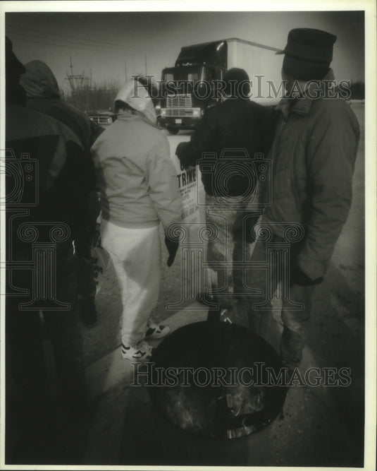 1994, Striking Teamsters watch truck leave UPS facility, Oak Creek. - Historic Images