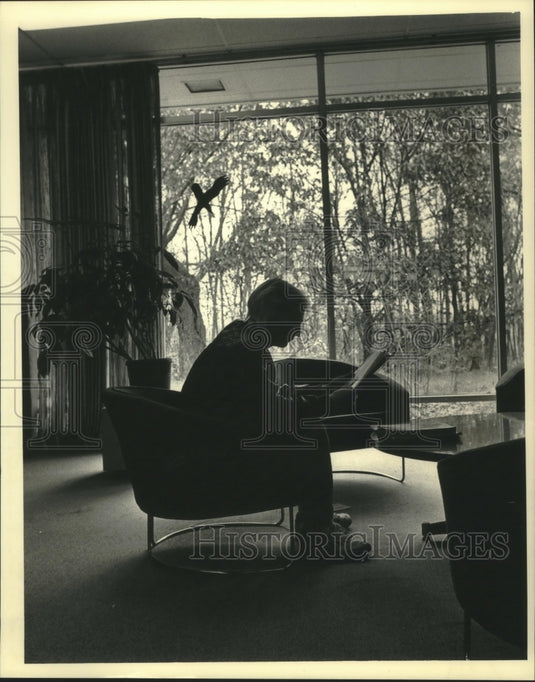 1987, Derrick Bey reads in Library at University of Wisconsin - Historic Images