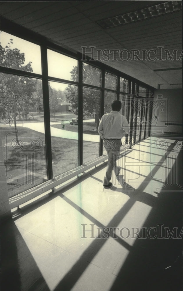 1985, Student walks corridor, University WI-Washington County Center - Historic Images