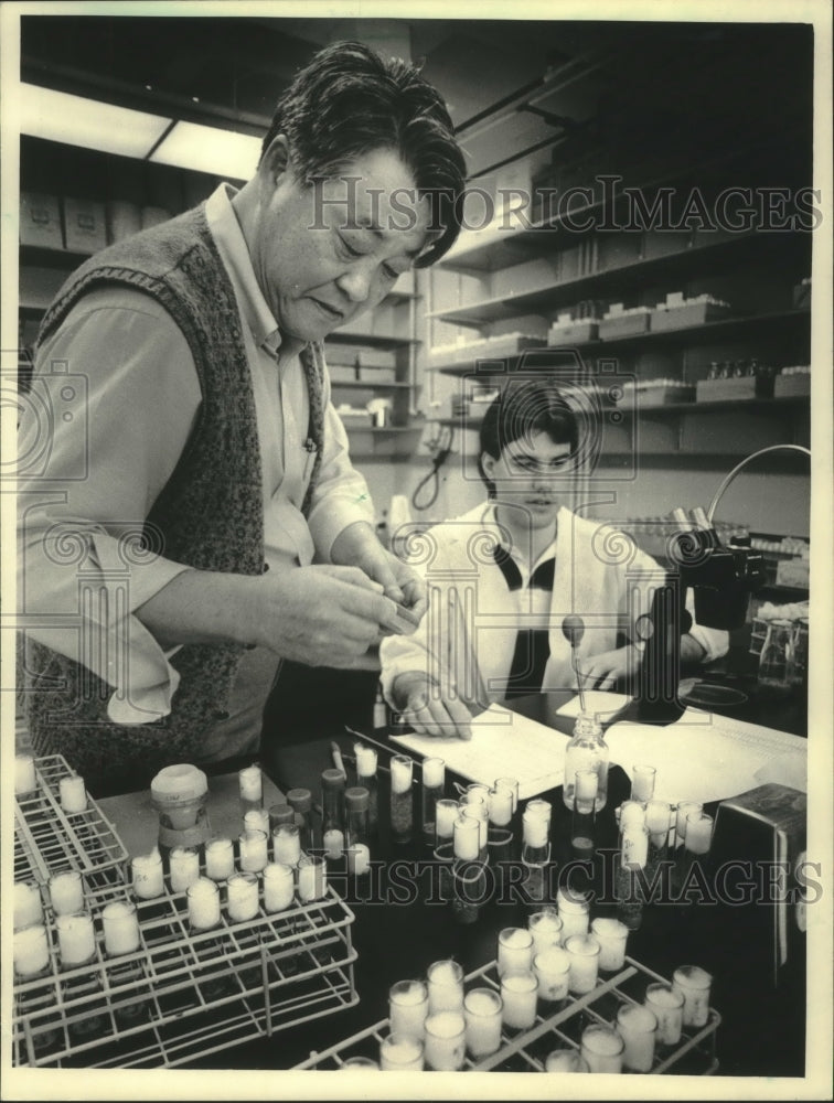1986, Professor Johng Lim and Chris Schad work in lab, UW-Eau Claire - Historic Images