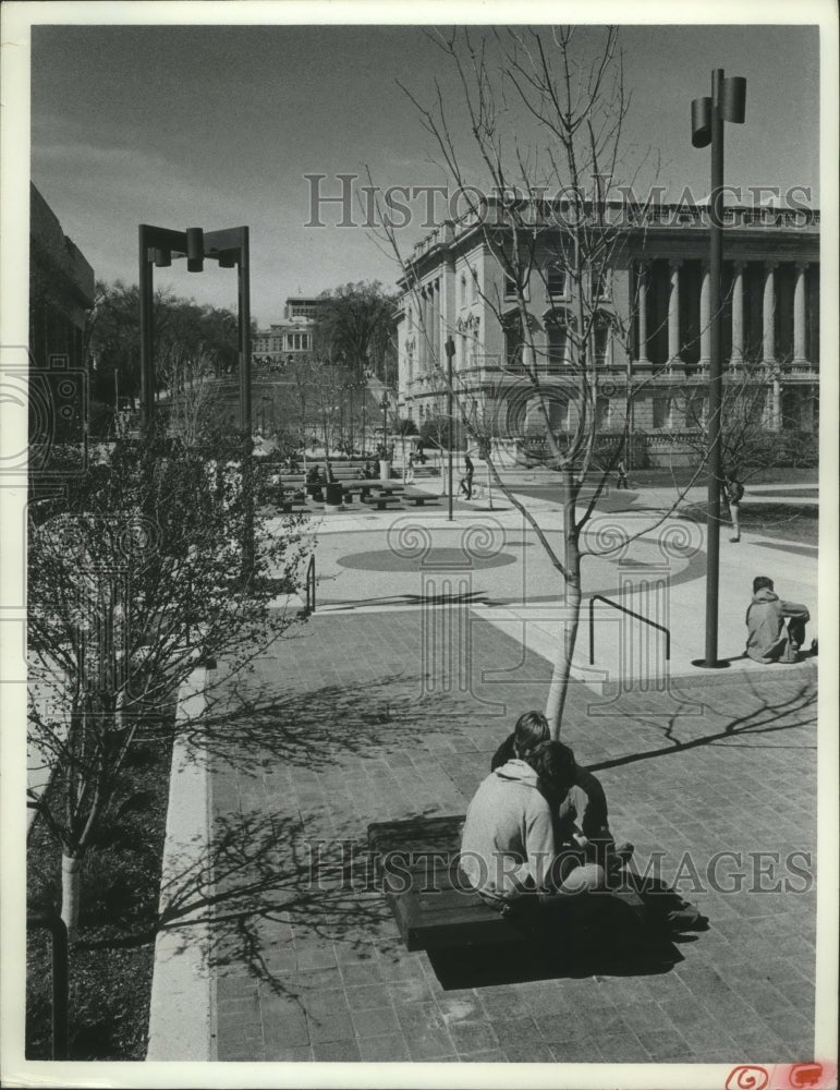 1976, UW Students sit in Pedestrian Mall at the foot of Bascom Hill. - Historic Images