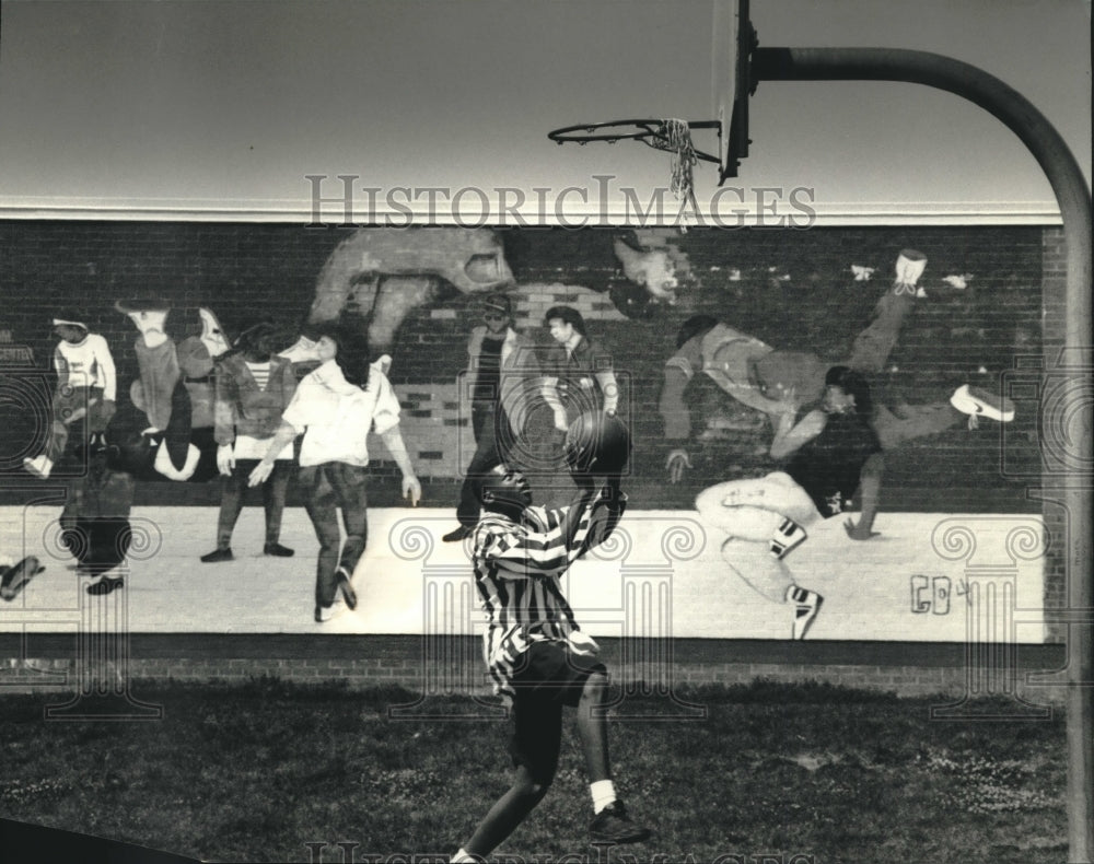 1993 Tracy Cole plays hoops behind Silver Spring Neighborhood Center - Historic Images