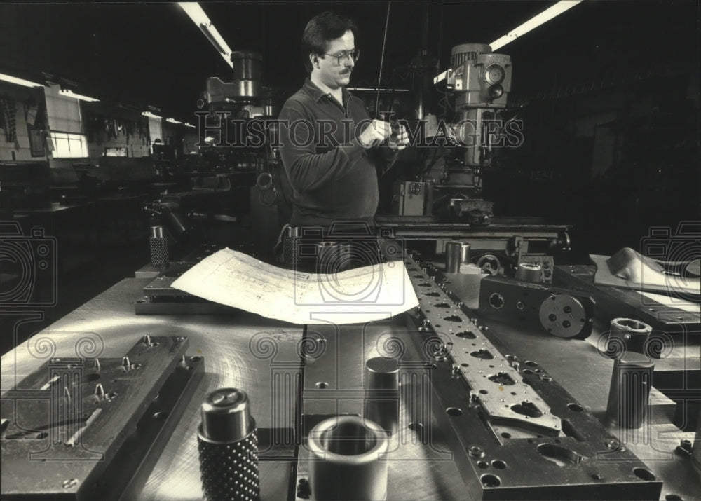 1992, Ken Singer inspects a part at Singer Tool &amp; Die - mjc16073 - Historic Images