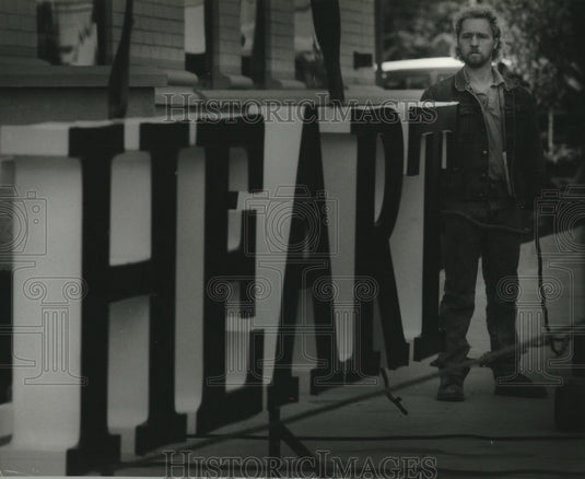 1993 Mike Biddle helps with sign Milwaukee Heart Institute Milwaukee - Historic Images