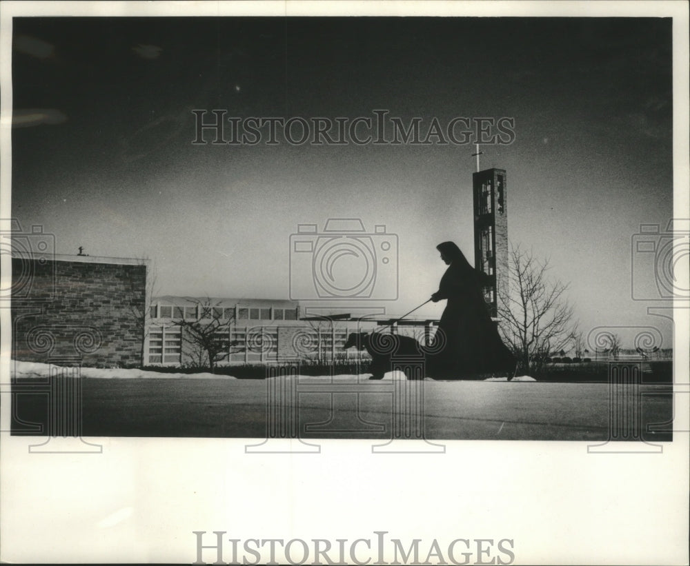 1965 Press Photo Afghan hound takes sister for run School Sisters of Notre Dame - Historic Images