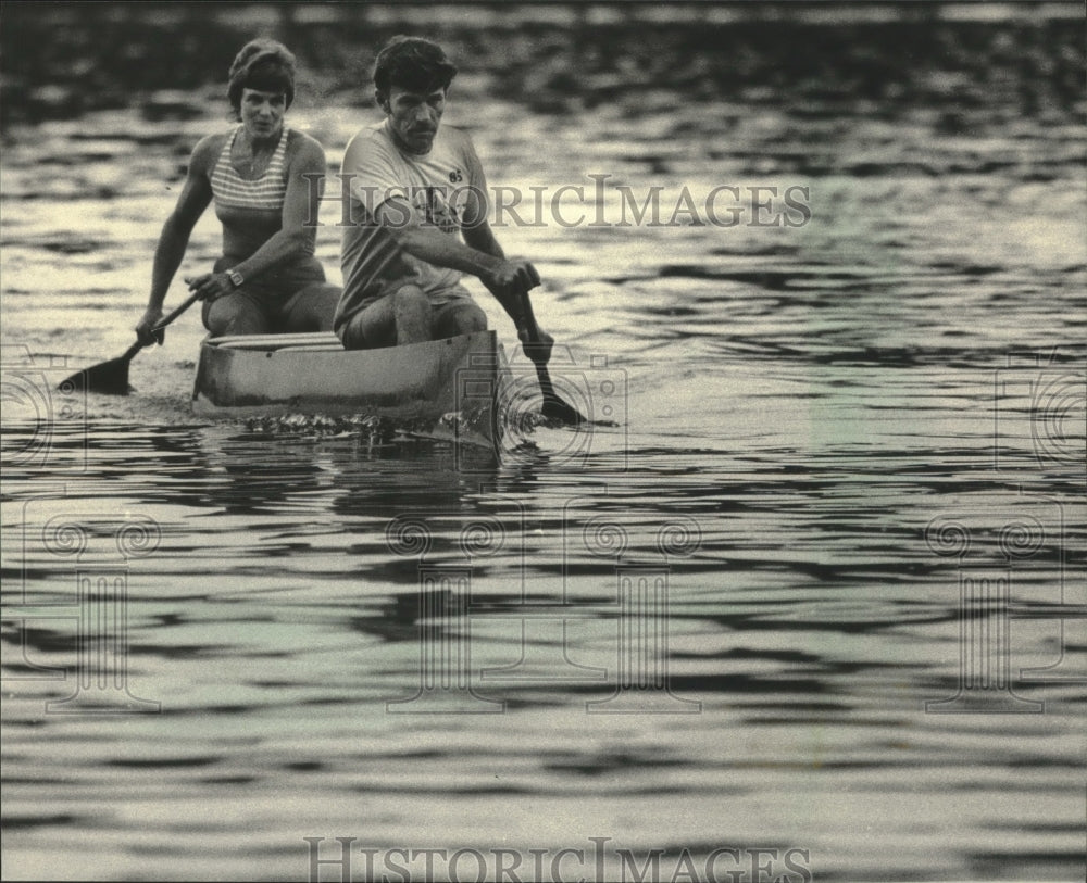 1985, Beth and Errol Schluter canoeing on Nashotah Lake in Wisconsin - Historic Images