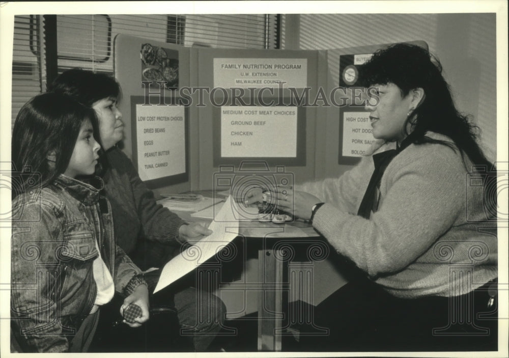 1991, Elsa Torres speaks to clients, Sixteenth Street Health Clinic - Historic Images
