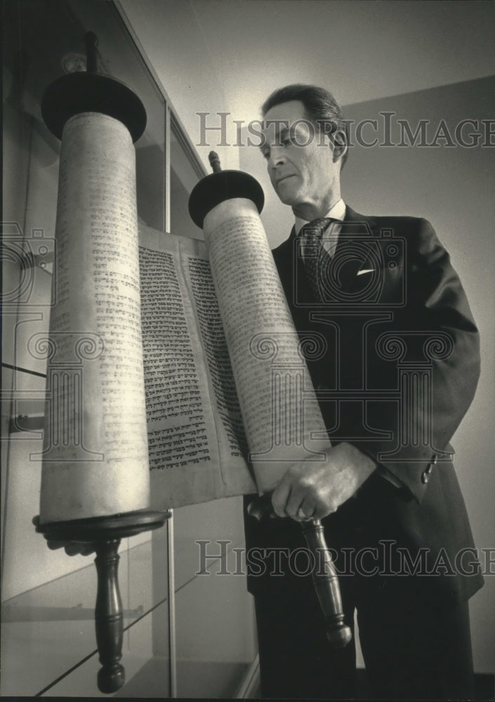 1992, Rabbi Francis Barry Silberg holds a Torah scroll - mjc16512 - Historic Images