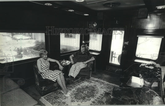 1983 Dianne and Dick Sharratt, Jefferson, Wisconsin, in rail car. - Historic Images